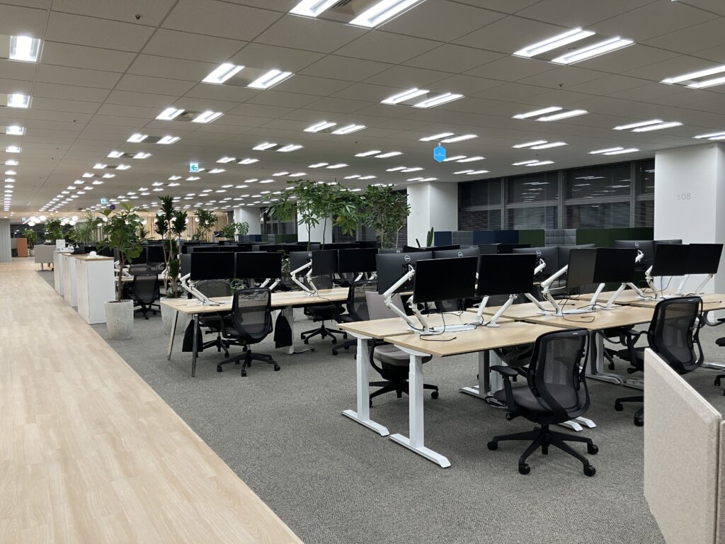 IT and AV Infrastructure for a European Biotech Office Expansion in Tokyo 1 Tokyo office with desks and monitors